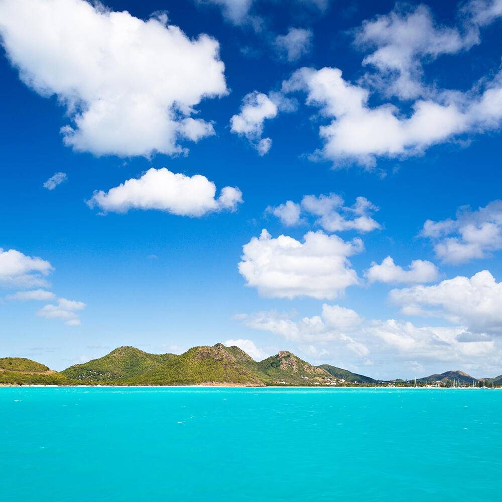An island in the azure blue Caribbean visited by Motor Yacht Loon